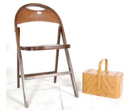 An early 20th Century 1920's Art Deco vintage bentwood fold chair having tortoise shell effect tho the domed backrest and sea