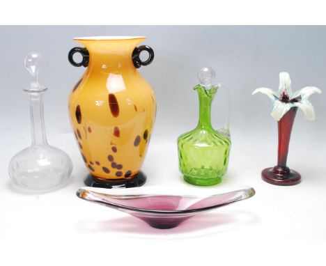 A collection of antique and vintage glass to include two early 20th Century decanters, a Victorian ruby and uranium glass fla