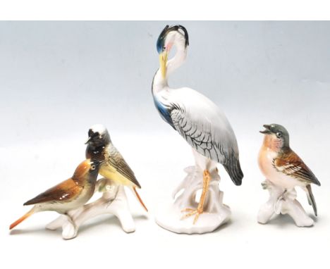 A group of three porcelain ceramic figurines of birds by Karl Ens. To include a large Heron and three small birds. All having