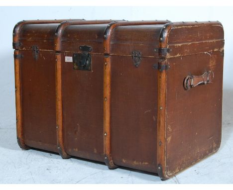 A late 19th century Victorian / early 20th century Victorian canvas travel trunk with wooden bindings and brown canvas finish
