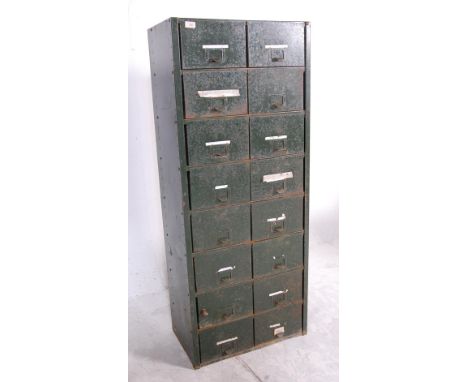 A vintage mid century metal industrial factory engineer drawers having 16 drawers with hook handles finished in green. Measur