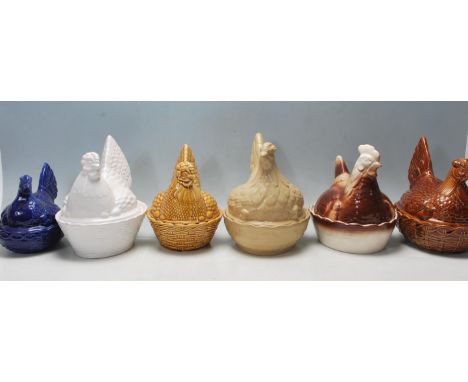 A collection of six vintage 20th century hen on nest ceramic basket / egg basket of a typical form with lids in a shape of a 