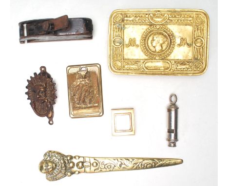 A collection of antique metal wares to include a cast brass letter opener in the form of a court jester, a 1914 WWI first wor