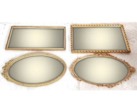 A set of four vintage antique style wall hanging mirrors. Two rectangular mirrors with bevelled glass and two oval mirrors wi