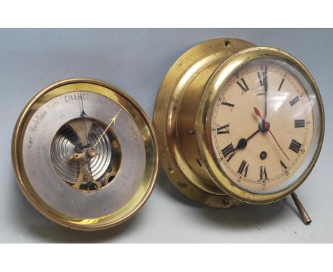 An original vintage military bulkhead brass 8 day ships clock made by FW Elliot Ltd of Croydon. The ships clock having Roman 