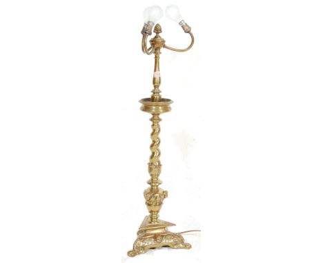 An antique style 20th century brass floor standing lamp having three light bulbs arms, turned and barley twist column with a 
