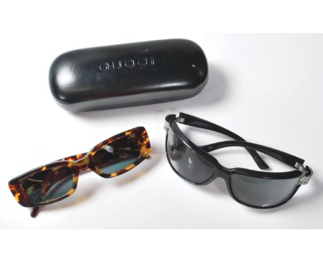 Two pairs of vintage ladies Gucci designer sunglasses to include a pair of tortoise shell sunglasses model number GG 2409 in 