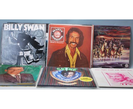 A good mixed collection of 20 vinyl long play LP records of varying artists and genres to include W.A.S.P. Sunset &amp; Babyl