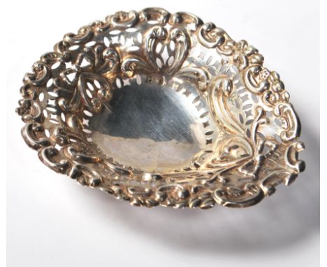 A 19th Century Victorian silver hallmarked trinket pin dish having repousse bow garland decoration with pierced decoration th