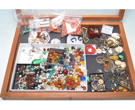 A collection of mixed jewellery findings and parts to include various loose beads including a good quantity of coral, a selec