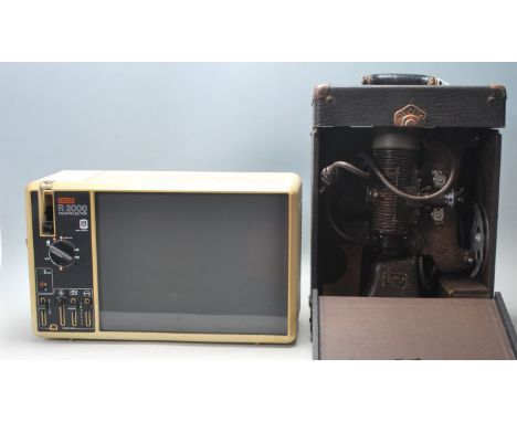 A vintage retro 1980s Eumig 4200 Instaprojection super 8 8mm cinema projection viewer together with a Bell and Howell Filmo 8