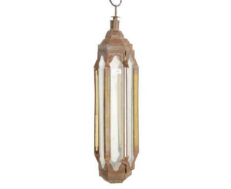 A 20th century pressed metal and leaded, coloured glass Moroccan - North African lantern. The hanging lantern of octagonal fo