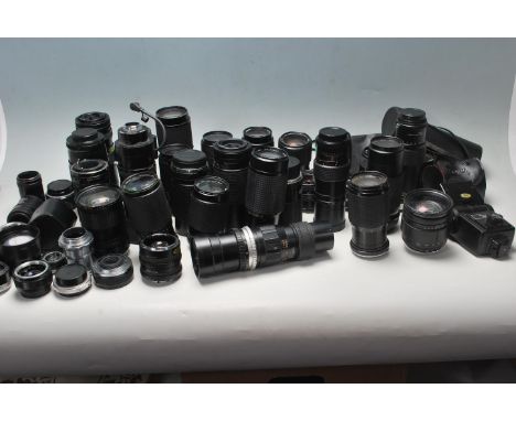 An extensive collection of vintage camera lenses / photographic lenses to include: Bell &amp; Howell 1:4.5 80-205mm macro, Ha