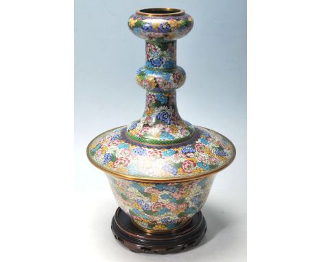 A good Chinese cloisonne enamel and brass mounted vase. The heavily enamelled vase raised on wooden socle plinth base. Of unu