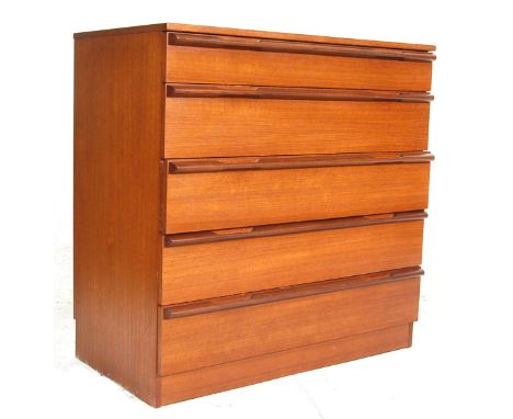 A vintage Avalon danish inspired Teak wood chest of drawers with four graduated drawers with lozenges handles raised on a pli