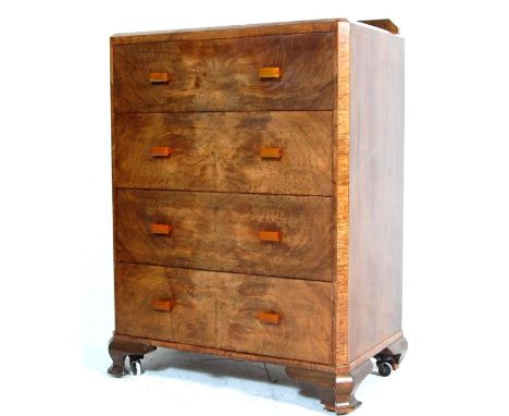 A 1930’s Art Deco walnut chest of drawers having small gallery back, bevelled top, four large drawers with bakelite block han