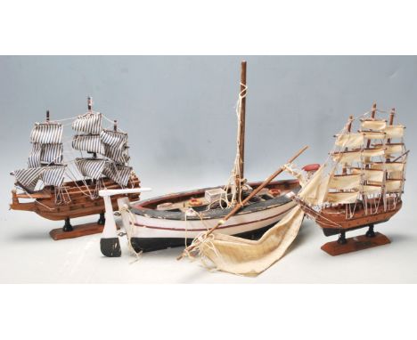 A collection of three scratch built model sailing / fishing ships comprising of a wooden fishing boast painted in red white a