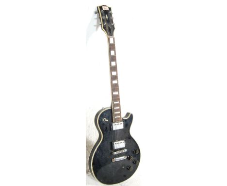 A vintage 20th Century Columbus Les Paul style electric guitar having a black body with four plastic dials, two humbucker pic