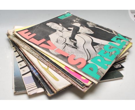 A collection of vintage 12” LP vinyl records to include Rolling Stones 1st press, Sex Pistol 2nd Press, Elvis German press an