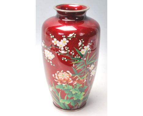 A stunning believed early 20th century Chinese enamelled famille rose vase with stunning deep red enamel ground inset with sc