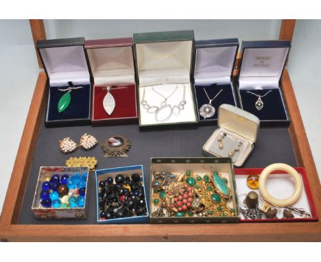 A collection of vintage and antique jewellery to include silver pendant necklaces, a pair of yellow metal and faux pearl clip