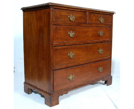 A 19th Century George III solid mahogany two over three chest of drawers. The chest having a flared edge top with short and d
