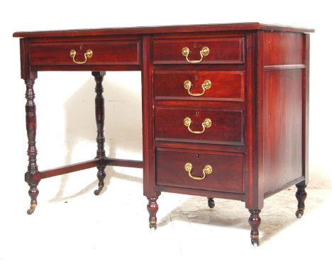 An antique Victorian mahogany and leather writing table desk. The desk having a green leather writing skiver over a single dr