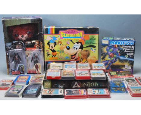 An assorted collection of vintage and contemporary toys and action figures. To include; a Walt Disney ' Sliderama ' projector