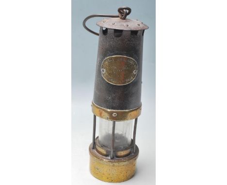 An early 20th Century vintage E Thomas & Williams Ltd & Morris Ltd of Aberdare miners lamp having a brass cylindrical body wi