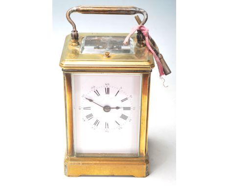 A good 20th century French brass carriage clock repeater. The brass case with bevelled glass housing a repeating movement and
