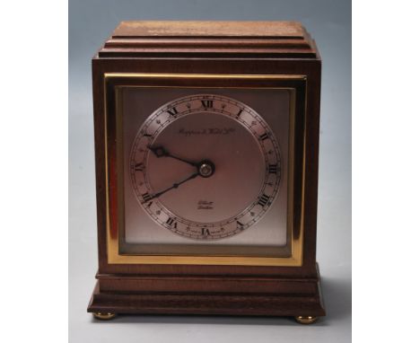 A 20th century Mappin &amp; Webb of London Elliott mantel clock. The silvered dial with roman numeral chapter ring having fac