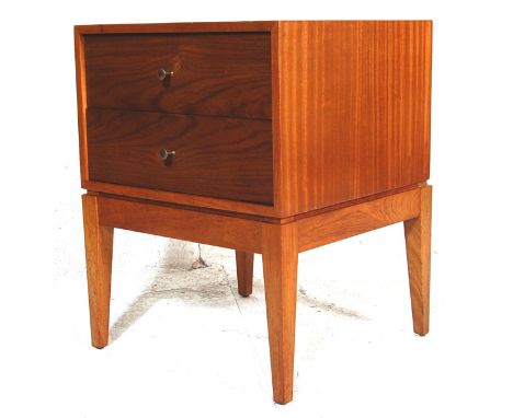 A vintage 20th century teak wood Uniflex bedside cabinet of a square form with two drawers, brass knob handles raised on four