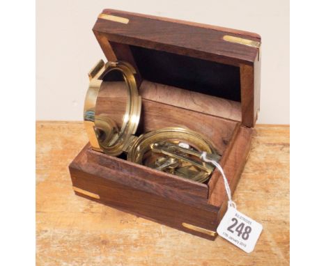 A Brunton brass compass in hardwood box 