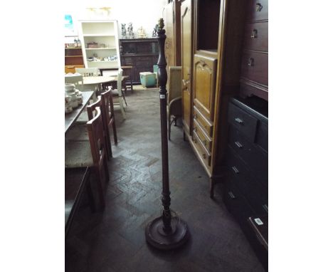 A turned mahogany standard lamp 