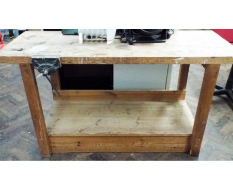 A heavy duty work bench with shelf under and vice etc  Approx 32 inches tall, 60 inches long and 24 inches wide