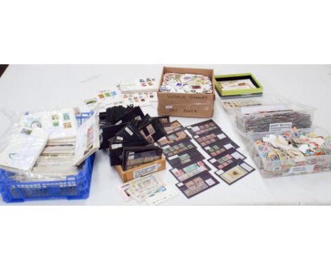 A large quantity of assorted stamps and first day covers. 400 stock cards with stamps, catalogue value over £1,000, plastic s
