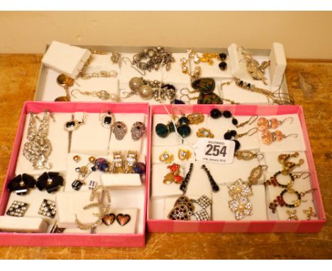 Large quantity of pierced earrings, some set with tigers eye, CZ, and enamel
