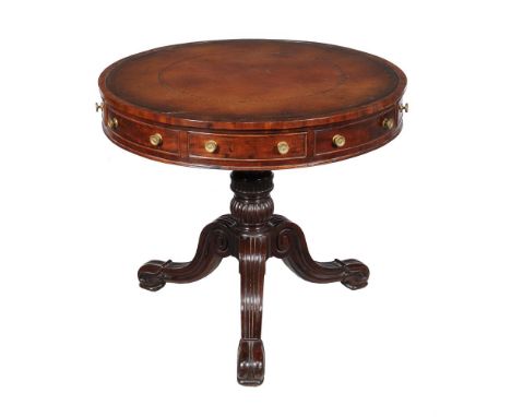 A WILLIAM IV MAHOGANY 'DRUM' LIBRARY TABLE  CIRCA 1835 With tooled leather inset top, above four frieze drawers and four alte