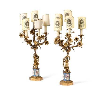 A PAIR OF GILT METAL AND PORCELAIN INSET FIVE LIGHT CANDELABRA  LAST QUARTER 19TH CENTURY Each modelled with flowering branch