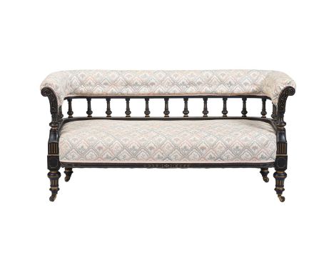 A VICTORIAN EBONISED AND PARCEL GILT SOFA IN AESTHETIC TASTE  LATE 19TH CENTURY  71cm high, 150cm wide, 61cm deep