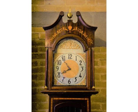 AN EDWARDIAN INLAID MAHOGANY LONGCASE CLOCK, arched silvered dial with Arabic numerals, triple weight movement, glazed trunk 