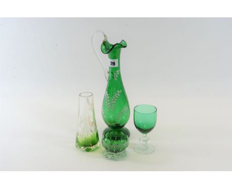 A PAIR OF VICTORIAN GREEN GLASS SALT CELLARS with white enamel decoration, a ditto green glass EWER with white floral decorat