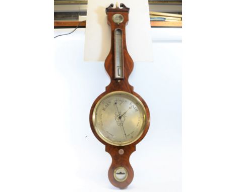 A. GUJERIG, A 19TH CENTURY WHEEL BAROMETER, with 10 ins silvered dial, long thermometer, hygrometer and spirit level, the swa