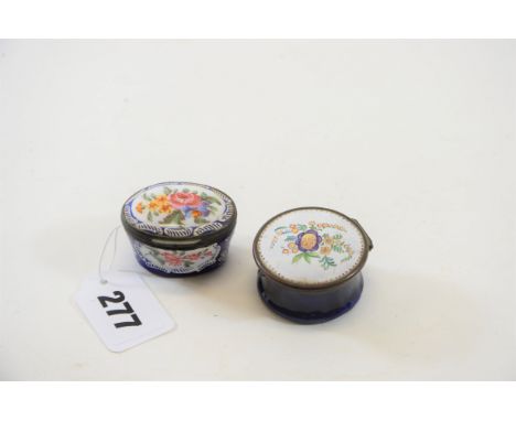 AN EARLY 19TH CENTURY OVAL BLUE ENAMEL PILL BOX, floral decorated lid with white border, 1 3/4 ins x 1 1/2 ins and a ditto bl