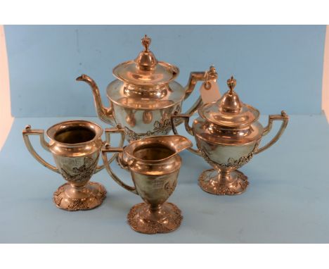 A LATE 19TH/EARLY 20TH CENTURY FOUR-PIECE SILVER-PLATED TEA SET with applied floral decoration comprising:- Teapot, sugar bas