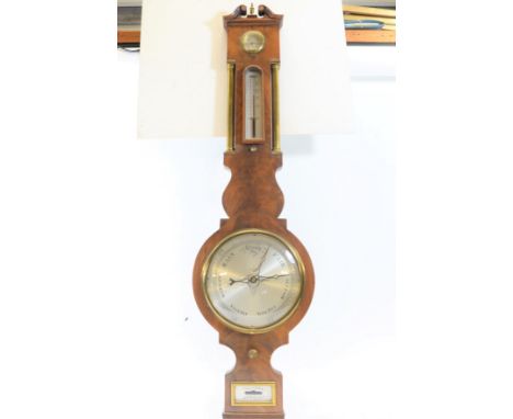 A GOOD QUALITY REPRODUCTION MAHOGANY WHEEL BAROMETER with 8 ins silvered dial, short thermometer, hygrometer and spirit level