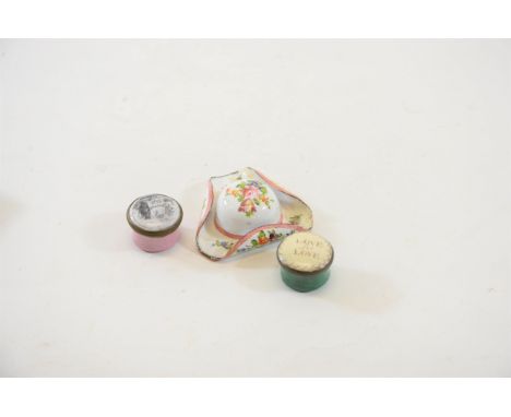 A 19TH CENTURY WHITE GROUND FLORAL ENAMEL TRICORN HAT, 2 ins across (some restoration), a pink/white enamel PILL BOX, en gris