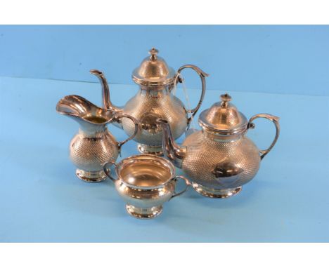 A LATE 19TH CENTURY CONTINENTAL SILVER-PLATED FOUR-PIECE TEA/COFFEE SERVICE of compressed circular form comprising:- Teapot, 