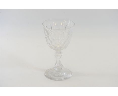 A LARGE VICTORIAN GLASS GOBLET with thumb cut bowl raised on a hollow baluster stem with circular foot-ring, 7 ins high.   £1