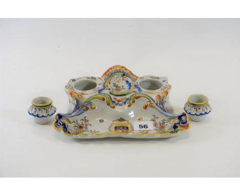 A FRENCH ROUEN FAINCE WARE INKWELL, floral decorated with heraldic shield and twin removable inkwells, 8 1/2 ins x 6 1/2 ins.